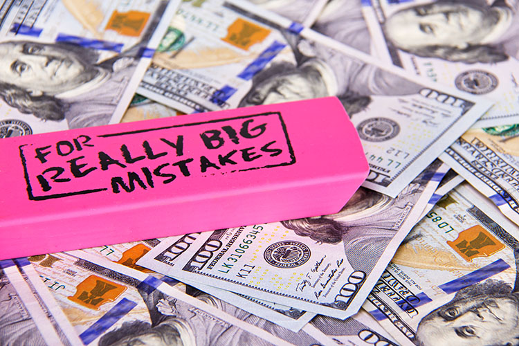 stacks of money lost in divorce mistakes