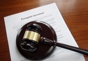 Prenup agreement on a desk with legal gavel